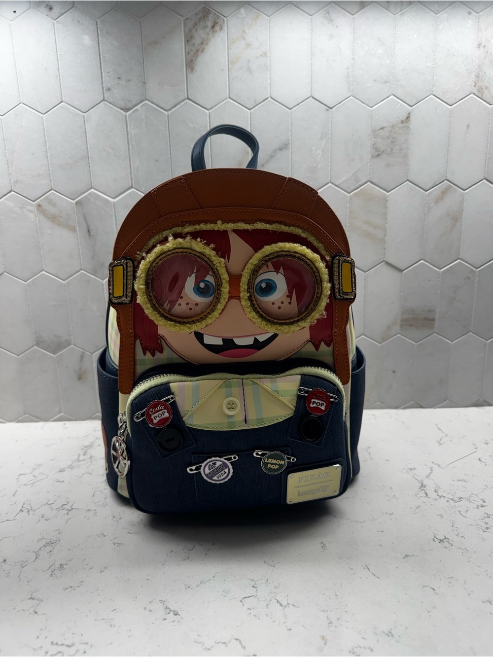 Young Explorer Ellie Cosplay mini Loungefly with removable googles.